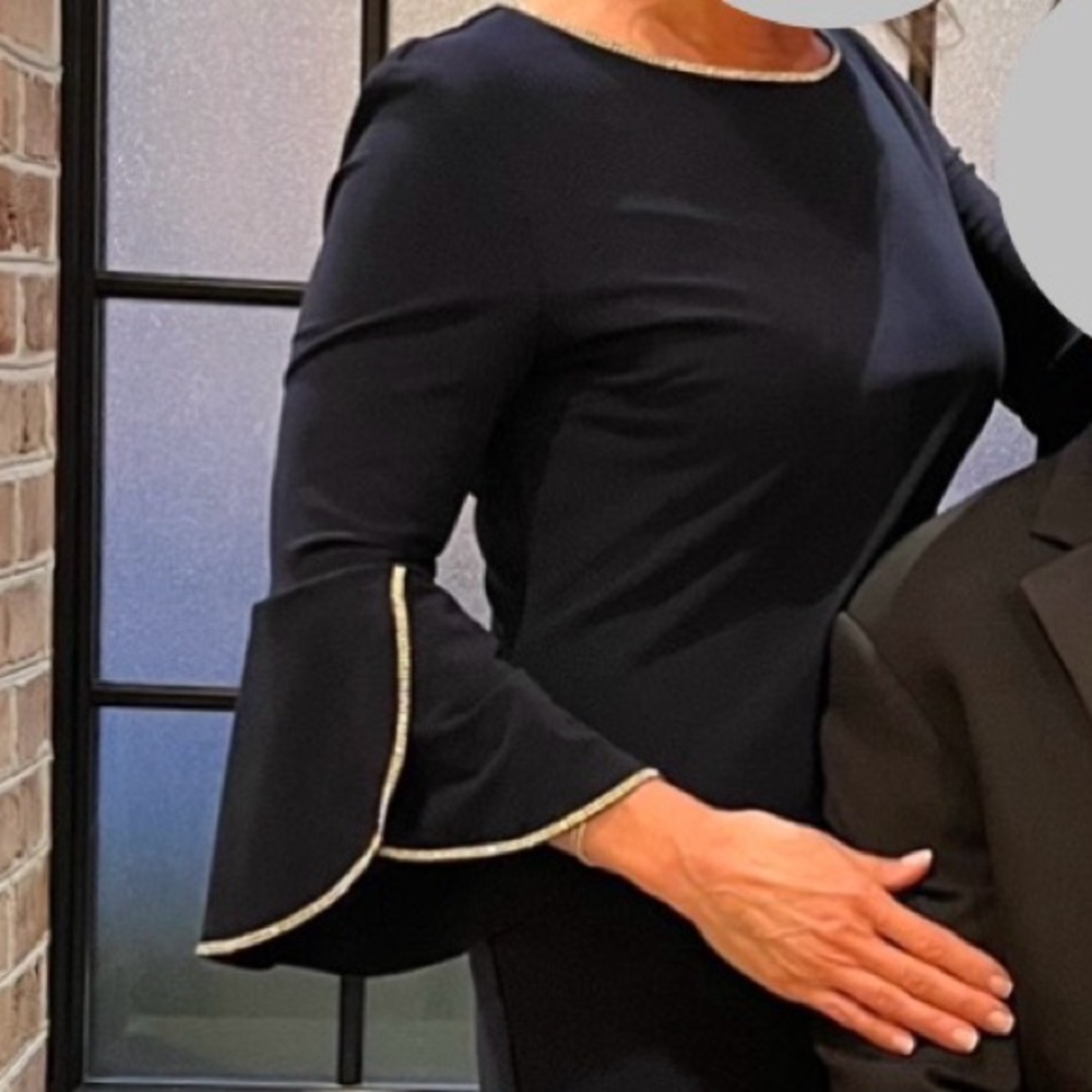 Frank Lyman navy cocktail dress with rhinestone detail.